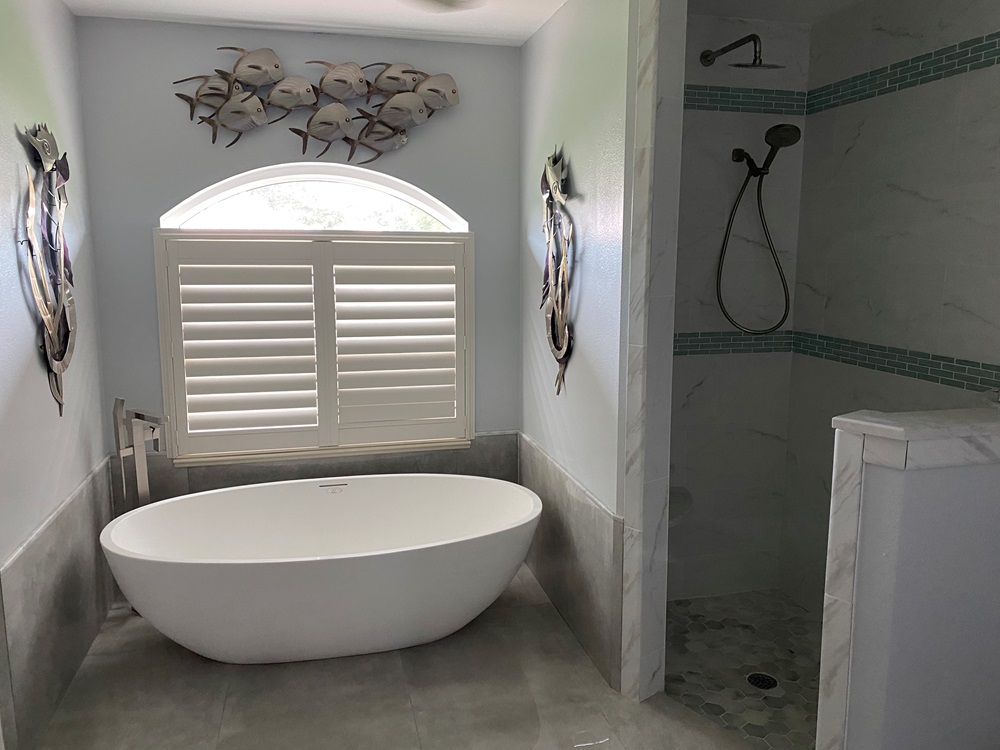 freestanding bathtub installed in alcove